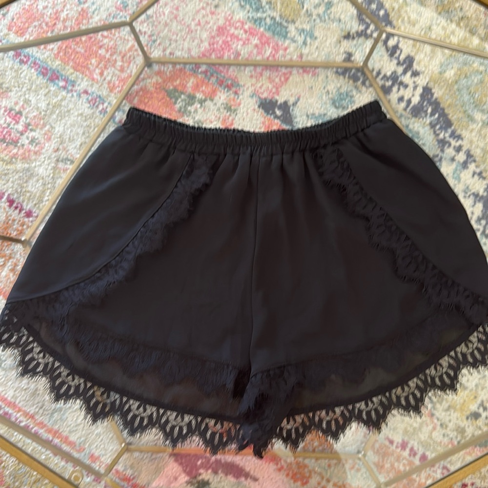 Audrey black lace dolphin shorts. Size M